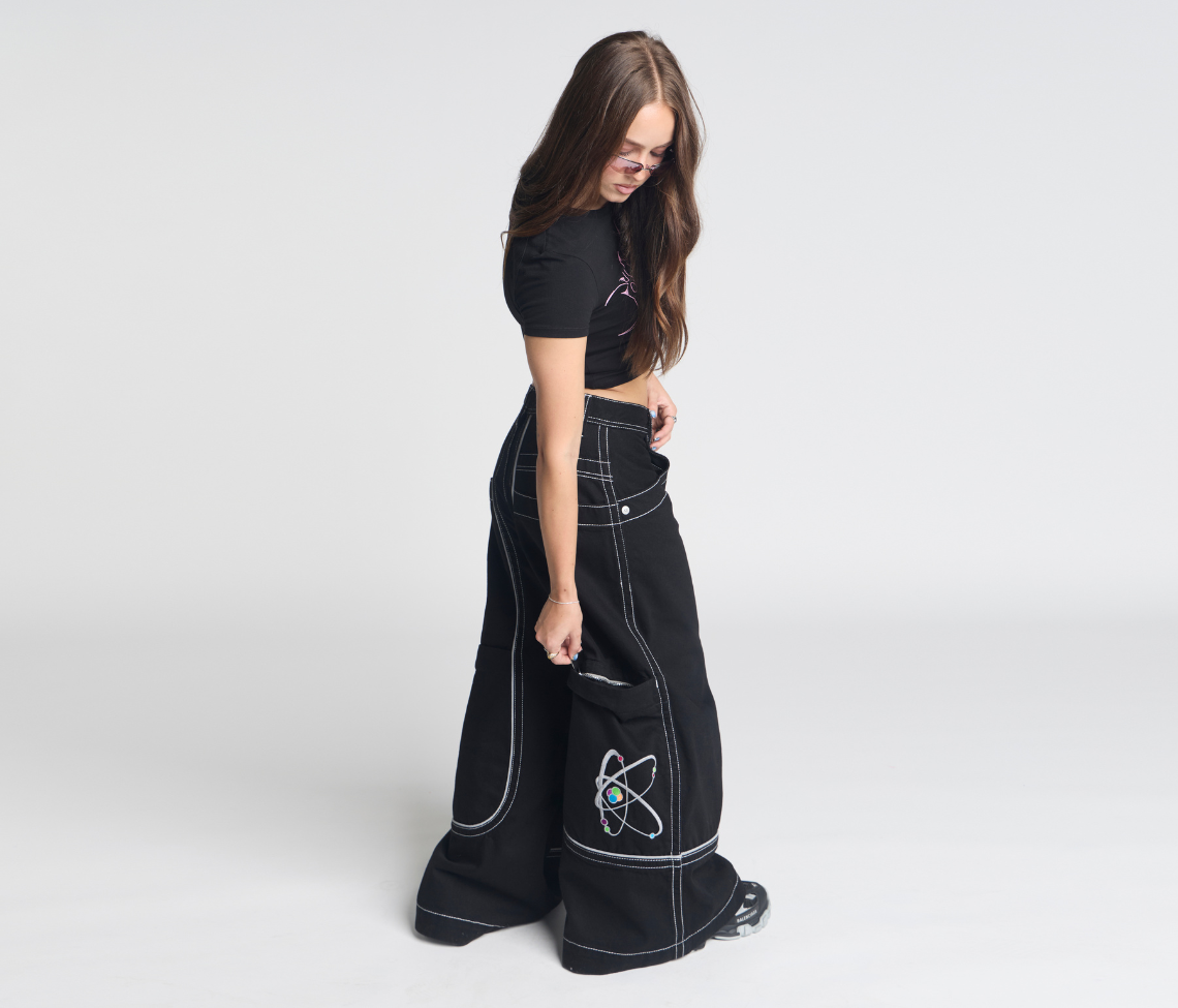 Atomic 34 Inch Super Black Rinse Pants With Bottom Leg Opening 26 Inch Deep Back Pockets And 13 Inch Zipper Compartments