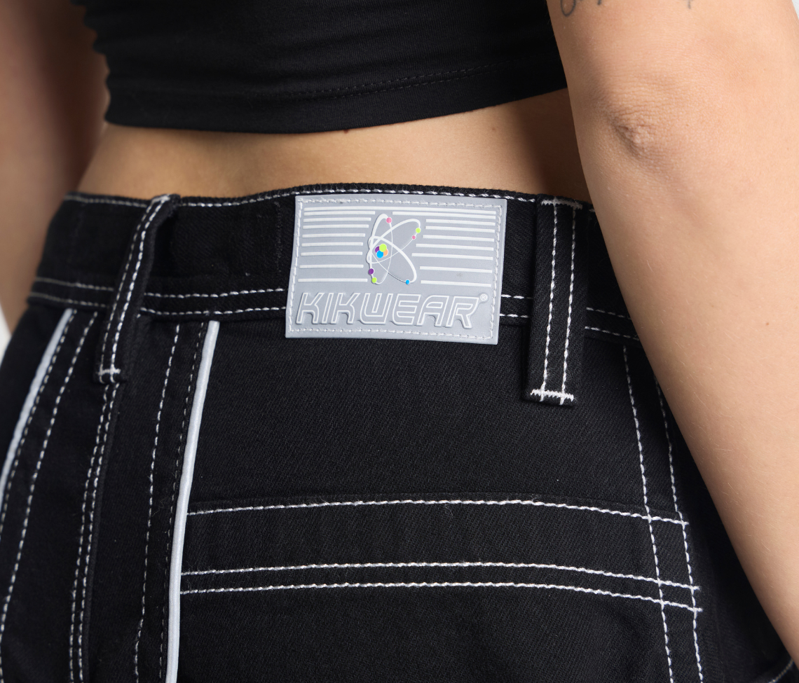 Atomic 34 Inch Super Black Rinse Pants With Bottom Leg Opening 26 Inch Deep Back Pockets And 13 Inch Zipper Compartments