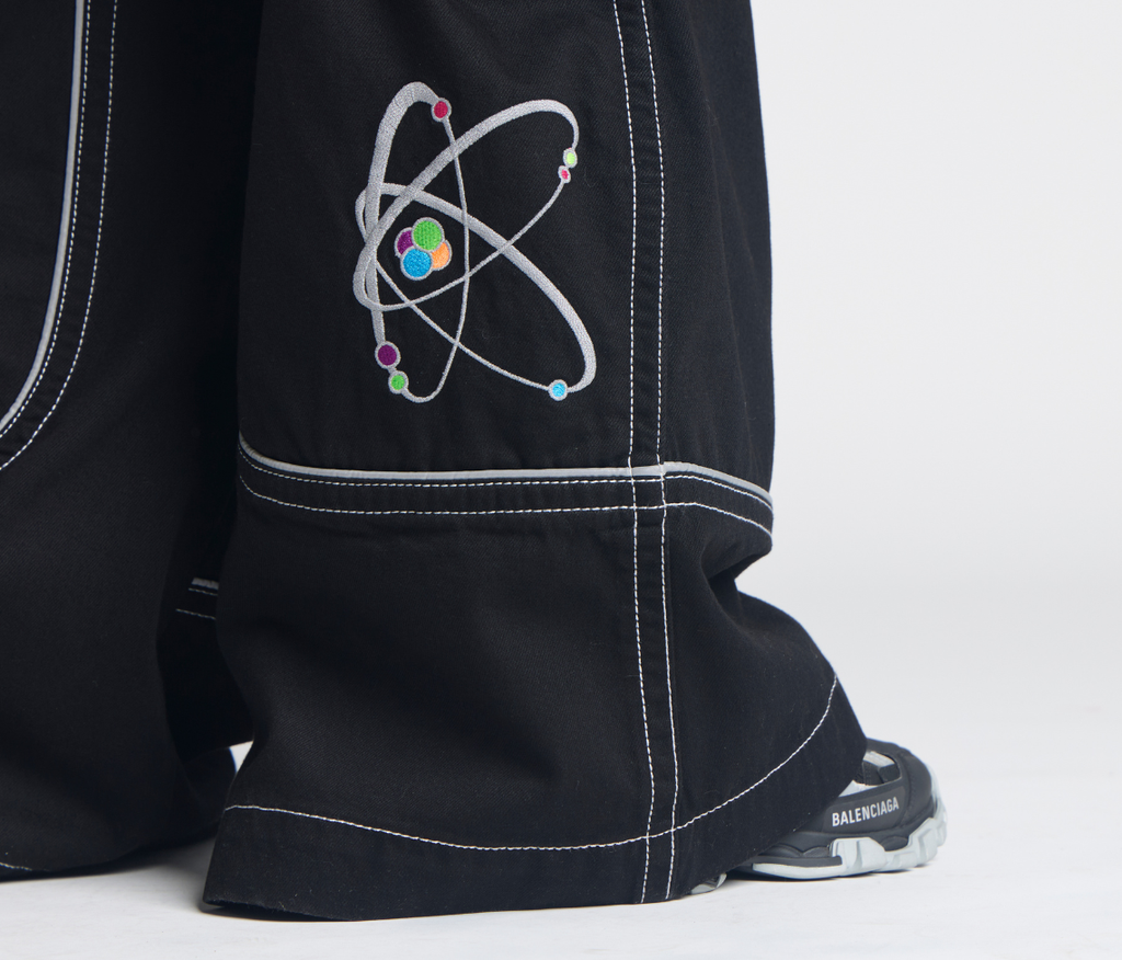 Atomic 34 Inch Super Black Rinse Pants With Bottom Leg Opening 26 Inch Deep Back Pockets And 13 Inch Zipper Compartments